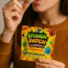 Woman eating a Stoner Patch Gummy while holding the product bag, with the Moonrock Online Shop logo on packaging.