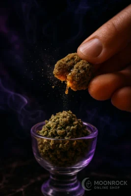 Close-Up of Hand Crumbling Sparkling Moon Rock Over Cannabis Bowl – High-Potency THC