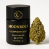 buy colombian gold Premium Moonrock Colombian Gold cannabis 1g jar beside a dense golden-green bud, matte black packaging with gold label and Moonrock Online Shop logo, COA verified for purity.