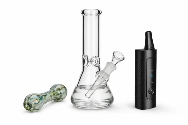 Moonrock weed delivery consumption devices including glass pipe, water bong, and dry herb vaporizer on white background