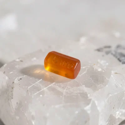 Close up of a single gummy or small dose on a clean surface.] Alt text: 5mg THC gummies edibles guide — beginner dose cannabis edibles California