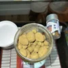Premium Sun Rocks THC Infused Flower Premium Sun Rocks infused cannabis flower coated in THC oil and kief inside a glass jar with golden crystal texture