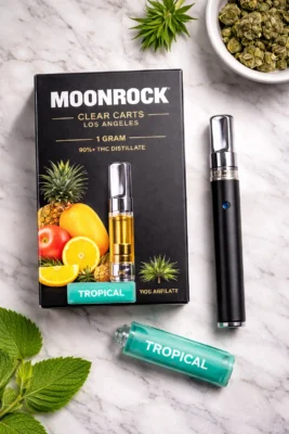 Moonrock Clear Carts flat lay with box packaging, vape cartridge and battery on marble surface Los Angeles