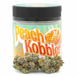 Premium Peach Kobbler strain flower displayed in branded jar packaging with visible trichome-rich buds. Peach Kobbler cannabis strain jar packaging with dense frosty buds on white background