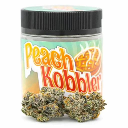 Premium Peach Kobbler strain flower displayed in branded jar packaging with visible trichome-rich buds. Peach Kobbler cannabis strain jar packaging with dense frosty buds on white background